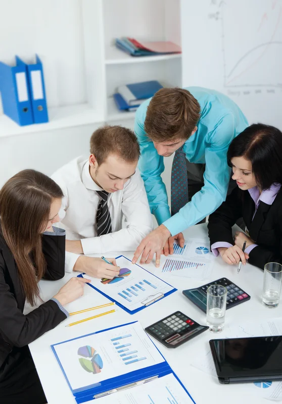Team reviewing charts and documents